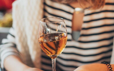 A woman enjoying wine