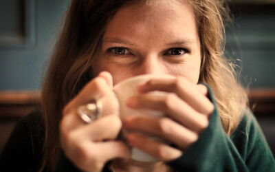 A woman drinking coffee