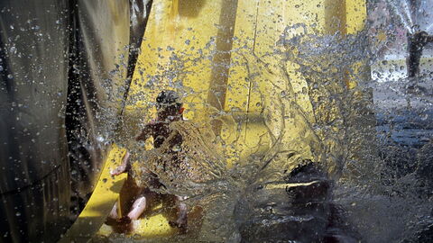 Landing at the bottom of a waterslide
