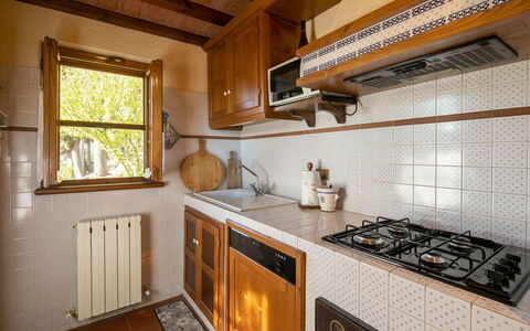 Villa Del Colle: Countertop, Cabinetry, Property, Kitchen Appliance, Window, Gas Stove, Kitchen, Kitchen Stove, Building, Wood