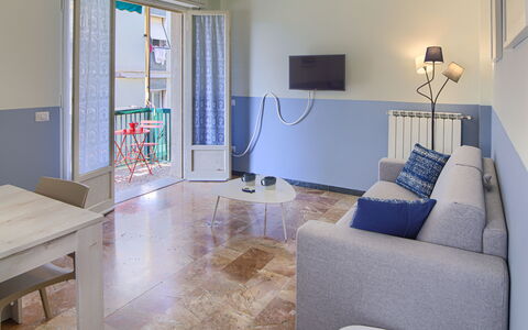 Giulia Apartment - Levanto: Table, Furniture, Couch, Picture Frame, Television, Interior Design, Floor, Living Room, Flooring, Real Estate