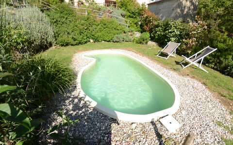 Al Colle Di Lari: Swimming Pool, Property, Natural Landscape, Grass, Water, House, Real Estate, Leisure, Estate, Landscape