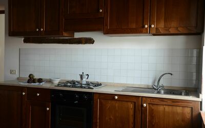 Borgo: Countertop, Cabinetry, Kitchen, Room, Furniture, Property, Sink, Tile, Lighting, Wood Stain