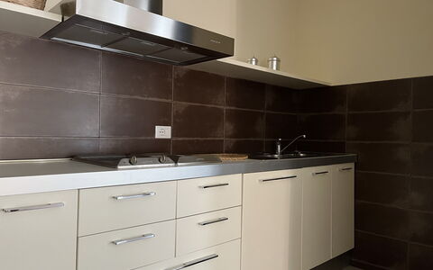 Gli Appartamenti Di Manuela: Cabinetry, Countertop, Property, Furniture, Building, Kitchen, Kitchen Sink, Wood, Kitchen Stove, Interior Design