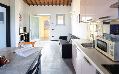 Farfalle: Cabinetry, Countertop, Kitchen, Table, Kitchen Stove, Interior Design, Wood, Architecture, Home Appliance, Floor