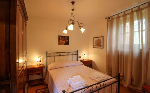Borgo di Usciano: Bed, Furniture, Bedroom, Interior Design, Wall, Floor, Flooring, Bed Sheet, Ceiling, Bedding