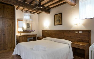 Suite 205: Bedroom, Room, Bed, Furniture, Property, Beam, Bed Frame, Bed Sheet, Building, Ceiling