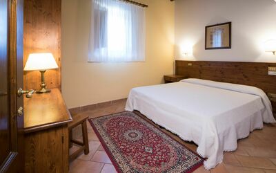 Suite 201: Room, Bed, Bedroom, Furniture, Bed Sheet, Property, Bed Frame, Mattress, Building, Floor