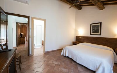 Camera 202B: Bedroom, Room, Furniture, Bed, Property, Building, Bed Sheet, Interior Design, Floor, Ceiling