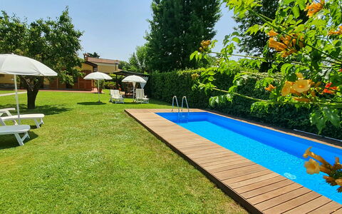 La Capannella: Plant, Shade, Tree, Sky, Swimming Pool, Building, Outdoor Furniture, Water, Real Estate, Flooring