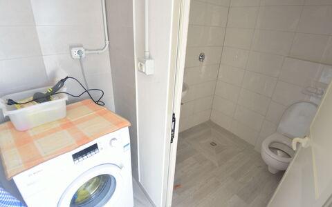 Villa Orchidea: Property, Room, Laundry Room, Bathroom, Clothes Dryer, Tile, Washing Machine, Major Appliance, Toilet, Toilet Seat