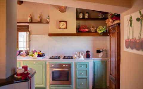 Villa Solaria: Cabinetry, Countertop, Property, Building, Kitchen, Interior Design, Wood, Kitchen Appliance, Orange, Flooring