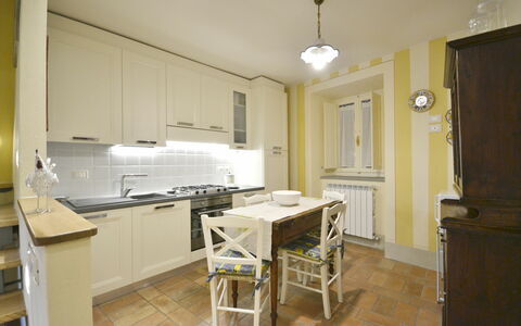 Appartamento Maccari: Property, Room, Furniture, Building, Kitchen, Floor, Cabinetry, Countertop, Interior Design, House