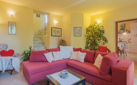 Giuliana: Table, Couch, Property, Furniture, Plant, Decoration, Living Room, Lighting, Architecture, Purple