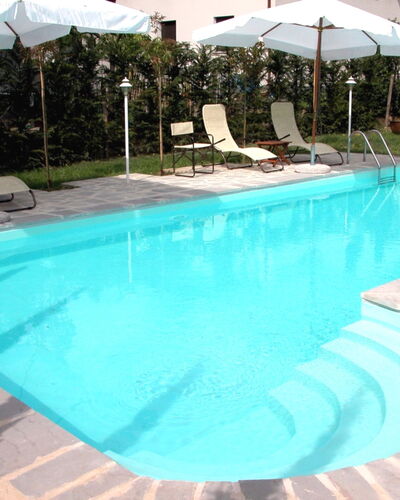 Monastery Guest House: Water, Plant, Swimming Pool, Building, Azure, Shade, Rectangle, Outdoor Furniture, Tree, Composite Material