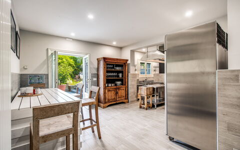 Villa Alfresco: Furniture, Flooring, Interior Design, Floor, Wood, Wood Flooring, Ceiling, Kitchen, Major Appliance, Countertop