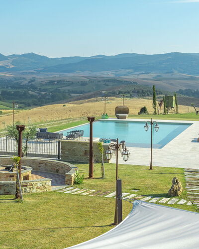 Villa Massimiliano: Sky, Mountain, Water, Cloud, Shade, Land Lot, Grass, Swimming Pool, Natural Landscape, Plant