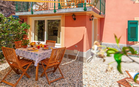 Portovecchio Apartments - Levanto: Property, Room, House, Building, Real Estate, Table, Furniture, Dining Room, Home, Patio