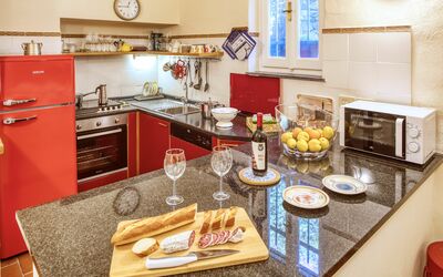 Sgombro Apartment - Levanto: Cabinetry, Food, Property, Countertop, Tableware, Kitchen, Blue, Wood, Kitchen Stove, Interior Design