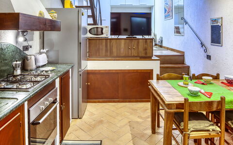 Mario - Levanto: Room, Furniture, Interior Design, Drawer, Cabinetry, Kitchen, Floor, Countertop, Major Appliance, Wood Stain