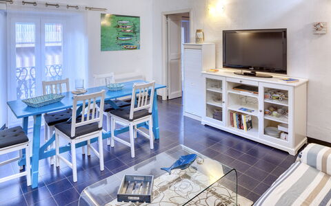 Appartamento Ivana - Levanto: Room, Interior Design, Floor, Furniture, Table, Television Set, Flooring, Interior Design, Home