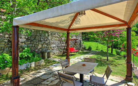 Villa Ancora: Plant, Property, Furniture, Plant Community, Table, Shade, Outdoor Table, Botany, Outdoor Furniture, Chair