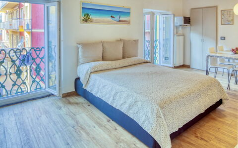 Studio Fede - Levanto: Furniture, Property, Blue, Comfort, Azure, Pillow, Textile, Wood, Window, Bed Frame