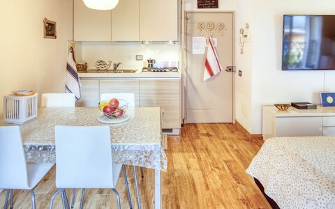 Studio Fede - Levanto: Table, Property, Furniture, Picture Frame, Wood, Interior Design, Orange, Chair, Floor, Real Estate