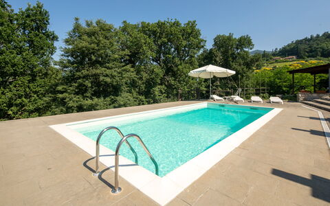 Grezzano Villa: Sky, Water, Swimming Pool, Tree, Plant, Shade, Outdoor Furniture, Rectangle, Building, Umbrella