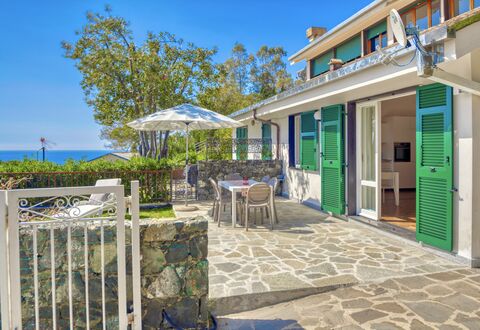 Marlà - Levanto: Sky, Property, Table, Plant, Building, Azure, Shade, Flowerpot, Door, Chair