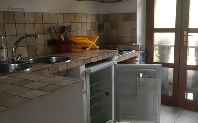 Apartment 2: Property, Cabinetry, Kitchen Stove, Countertop, Kitchen Appliance, Cooktop, Gas Stove, Wood, Kitchen, Interior Design