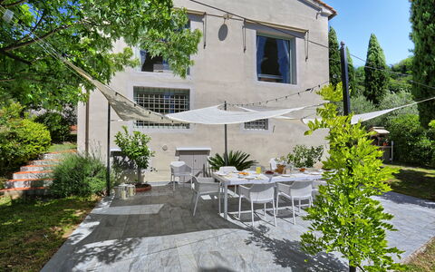 Villa Maona: Plant, Building, Furniture, Window, Table, Tree, Chair, Land Lot, Door, House