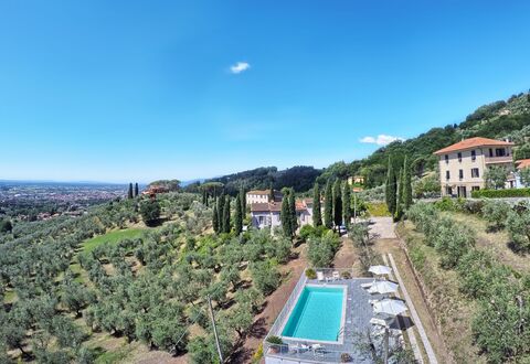 Villa Maona: Sky, Plant, Building, Water, Cloud, Azure, Tree, Vegetation, Urban Design, Residential Area