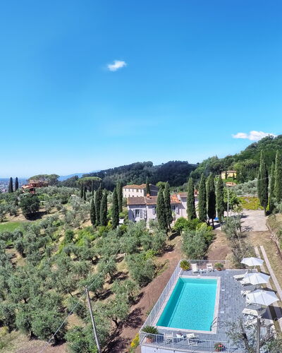 Villa Maona: Sky, Plant, Building, Water, Cloud, Azure, Tree, Vegetation, Urban Design, Residential Area