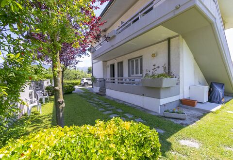 Pontremoli Apartments: Plant, Building, Property, Leaf, Botany, Grass, Tree, Shade, Urban Design, Neighbourhood