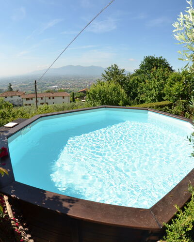 Alla Collina Del Sole: Water, Sky, Flower, Swimming Pool, Cloud, Nature, Plant, Rectangle, Shade, Outdoor Furniture