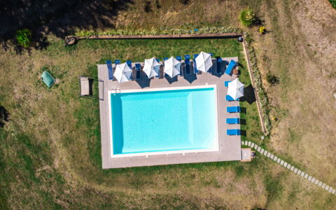 Villa Lugnano: Water, Plant, Swimming Pool, Window, Azure, Rectangle, Land Lot, Grass, Slope, Landscape