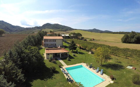 Villa Le Selvole: Sky, Cloud, Water, Building, Plant, Mountain, Tree, Land Lot, Swimming Pool, Grass