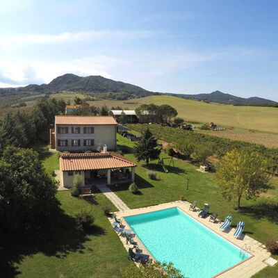 Villa Le Selvole: Sky, Cloud, Water, Building, Plant, Mountain, Tree, Land Lot, Swimming Pool, Grass