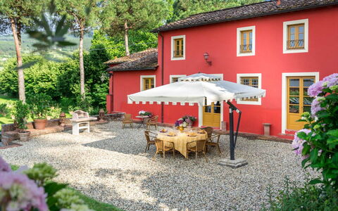 Villa Guamo: Plant, Building, Furniture, Window, Table, Chair, House, Umbrella, Outdoor Furniture, Tree