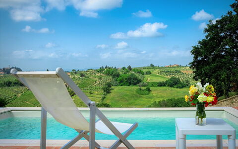 Villa Pianora: Water, Cloud, Sky, Plant, Nature, Azure, Outdoor Furniture, Chair, Flower, Swimming Pool