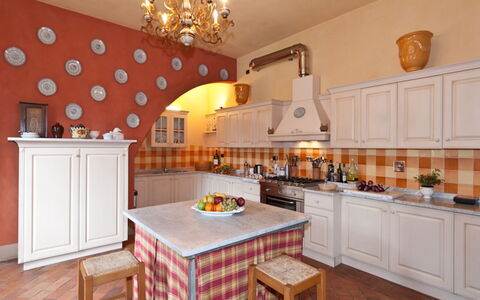 Villa Guasperini: Cabinetry, Countertop, Furniture, Property, Table, Wood, Orange, Interior Design, Lighting, Kitchen