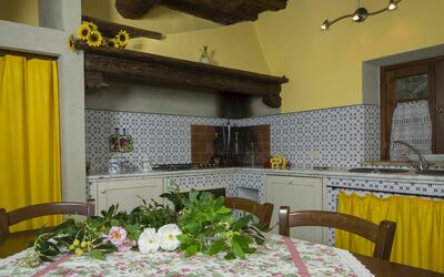 Orciaia Holiday Home: Property, Furniture, Cabinetry, Table, Countertop, Plant, Decoration, Kitchen, Textile, Interior Design
