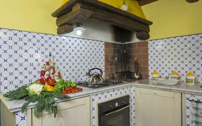 Rimessa Holiday Home: Cabinetry, Property, Countertop, Kitchen Stove, Tap, Kitchen Appliance, Yellow, Cooktop, Kitchen, Building