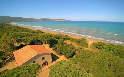 Giannella Holiday Apartment: Sky, Water, Plant Community, Building, Ecoregion, Cloud, Natural Landscape, Plant, Azure, Beach