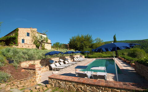 Villa Badia: Plant, Sky, Plant Community, Azure, Land Lot, Tree, Shade, Table, Outdoor Furniture, Grass