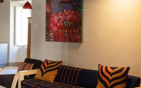 Appartamento Palei: Furniture, Property, Product, Comfort, Orange, Textile, Wood, Couch, Interior Design, Window