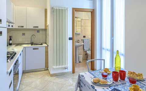 Apartments Mafalda - Levanto: Furniture, Property, Table, Food, Tableware, Building, Cabinetry, Interior Design, Door, Wood