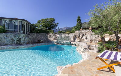 Oasi Suites: Water, Plant, Sky, Azure, Natural Landscape, Swimming Pool, Tree, Building, Body Of Water, Leisure