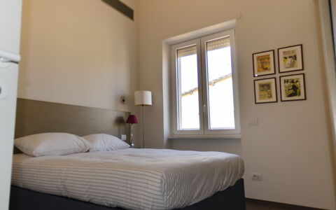 Sui Tetti Di Lucca: Furniture, Property, Building, Comfort, Window, Wood, Textile, Shade, Interior Design